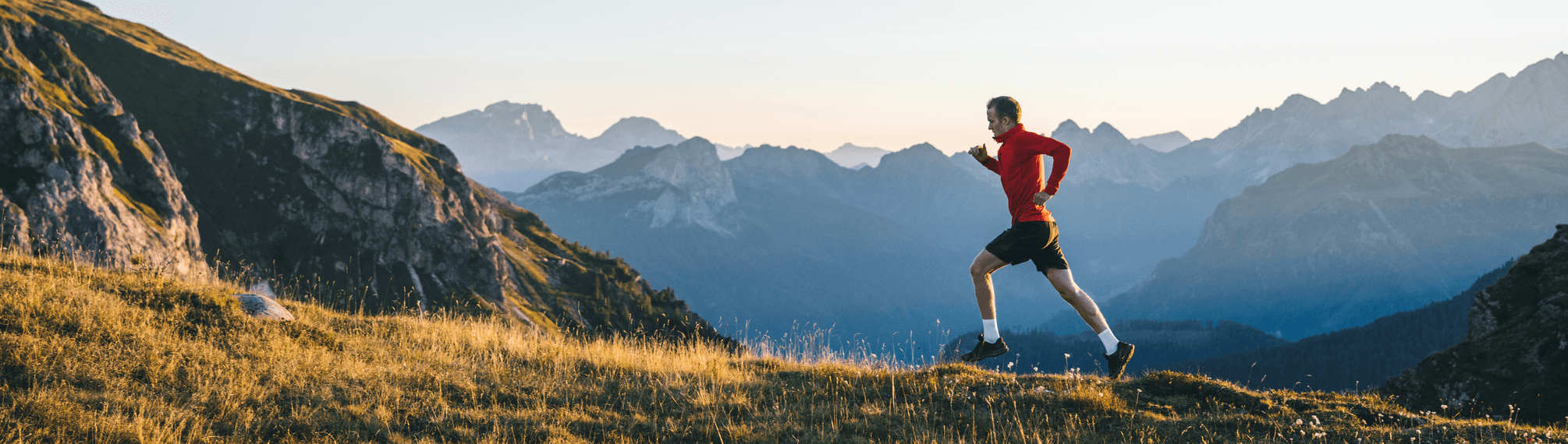 Performance runner in a mountain landscape