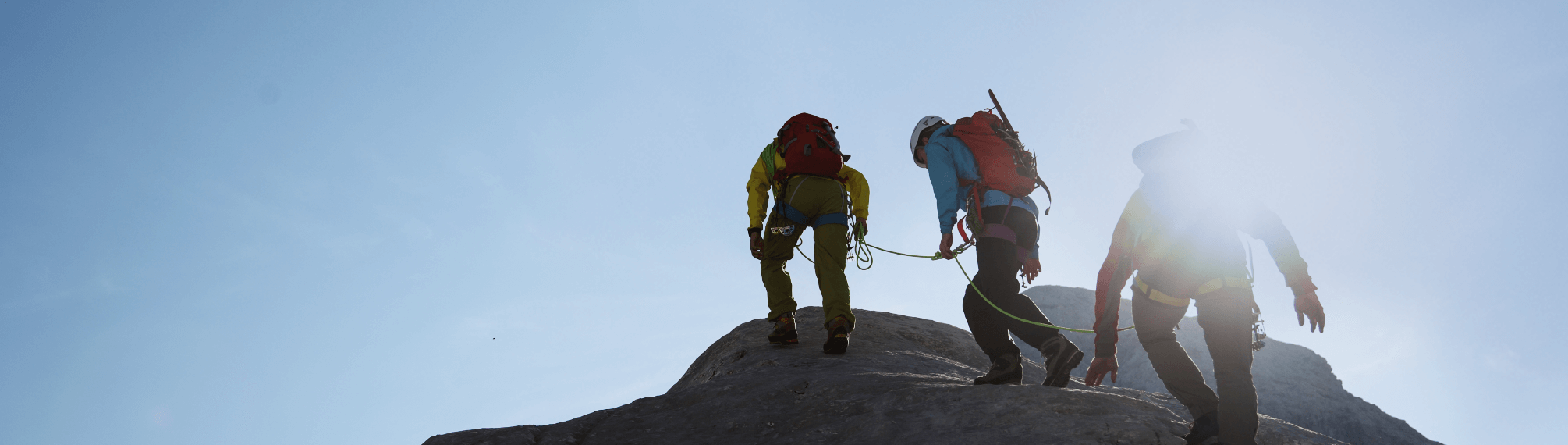 Mountain hikers reaching the top